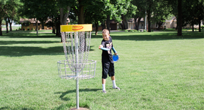Kid throwing Frisbee